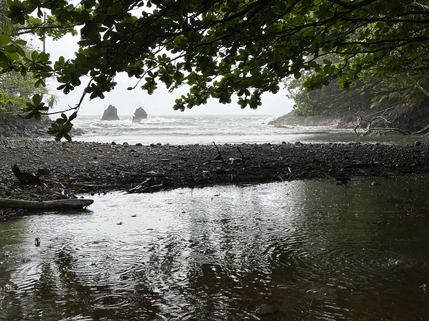 Still raining but no people on this hidden bay
