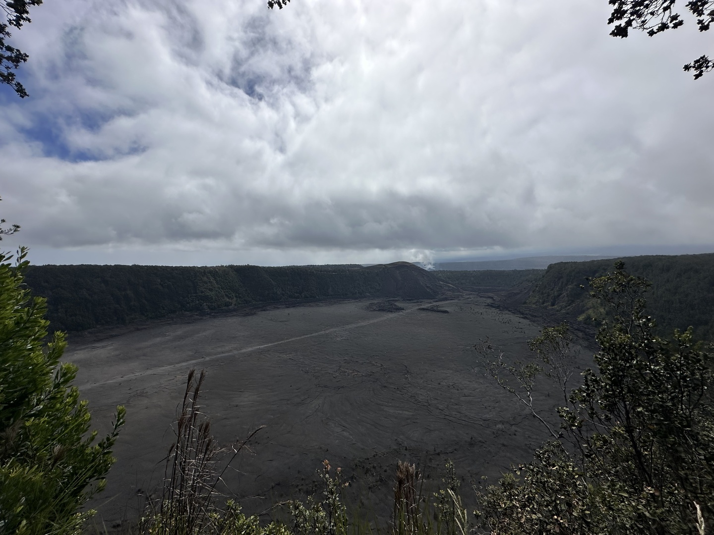 Look into the Kīlauea Iki crater and the trail crossing it