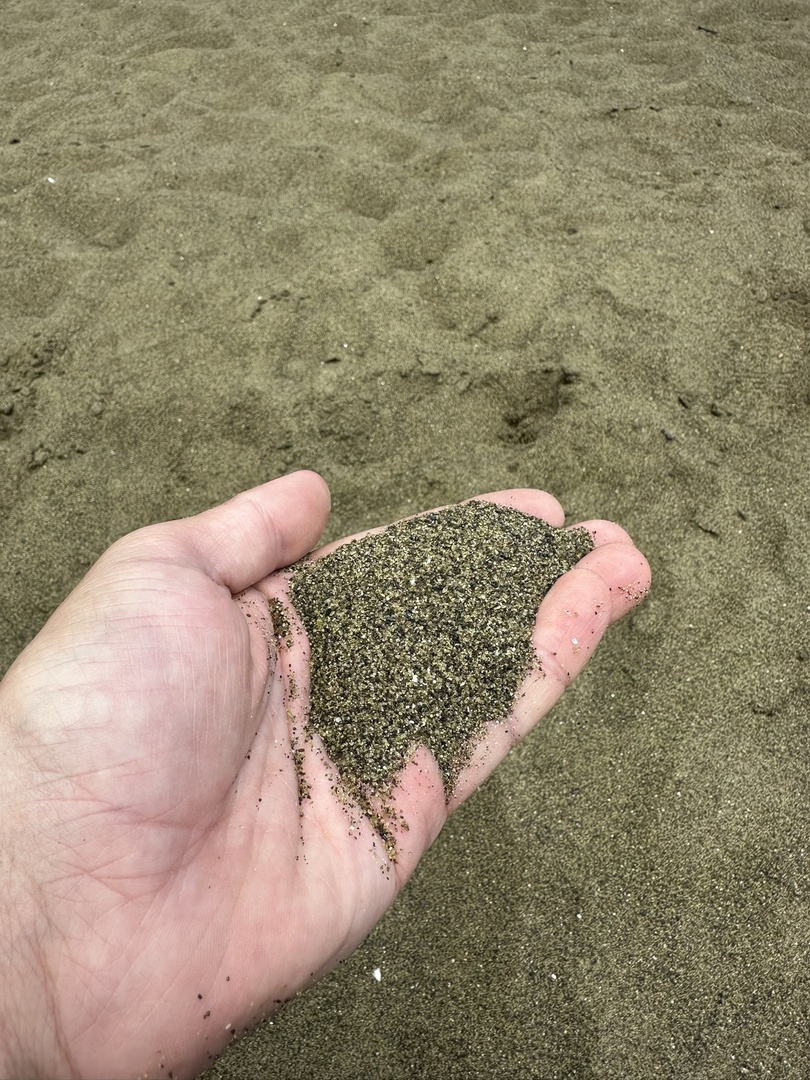 Green sand from minerals in the surrounding see makes this beach look green